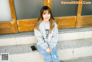A woman in a plaid shirt and pink panties posing for a picture.