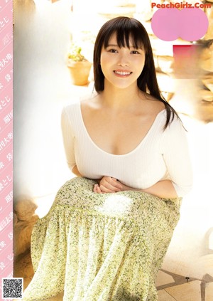 A naked asian woman sitting on top of a wooden table.
